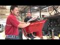 leif and the guys from car bench put the ferrari on the rack. then, leif removes the front bumper and the dash.