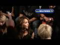 Miley Cyrus watches boyfriend at Christian Audigier show