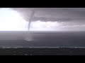 Tornados ripped through Lennox head and this is one of the water spouts about 10km north of Lennox. Filmed by Mark B.