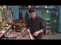 With a piece of oak, some string and a cigar box, John Park creates a three-stringed guitar. The cigar box acts as the resonating soundboard for the instrument. John then wires the guitar to a buck-fifty cassette-player amp and makes it really rock.