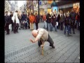 Old man doing baby freeze on a bottle