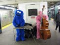 1 guy in cookie monster outfit on xylophone + 1 guy in pink gorilla outfit on upright bass + nyc subway = XYLOPHOLKS:  http://bit.ly/kJd8