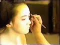 Maiko putting on makeup in Kyoto, Japan