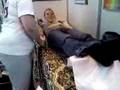 Kayleigh on a shaky masage bed at beauty show