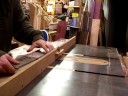Ryan Martin slots fretboards for a batch of Retro-Grads.