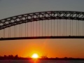 pictures taken at faber park on staten island, new york. multiple camera angles due to attempt to find the best photo.
 the sun sets behind the bayonne bridge over the kill van kull( waterway). the sun disappears behind port elizabeth new jersey. a few pictures of jet planes approaching newark liberty international airport.

muito obrigado a felix !

many thanks to f3xpgm's photography contest for inspiring me to take these photos.