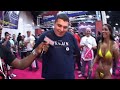At the New York Exxxotica Expo 2008 DJ Manny Norte interviews a fat dude who is getting whipped by Cristina Morandi  her friend. Can you believe he paid for this?