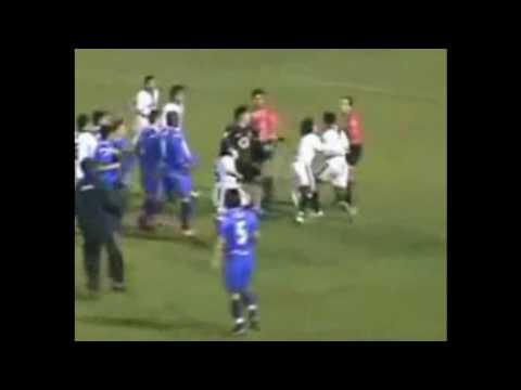 Watch 'YouTube				- A player tries to strangle the referee in a match in Chile'