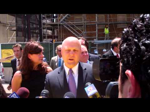 Mayor Landrieu, Canal St. Development Corporation sign final beam for historic Saenger Theatre