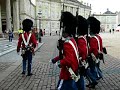 danish royal life guards in red gale uniforms - guard shift.
to celebrate the danish majesty queen margrethe the danish royal life guards wear their red gale uniforms -- 
daily they wear their black gale uniforms