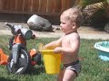 Kids playing outside in their little pool