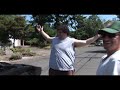 a fat guy squeezes out of a lamborghini style car during the summer of 69