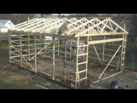 Garage. - Quick view of my Garage being built. This is my first YouTube video. The holes were drilled day one, complete building on day two. Enjoy. By the way, my 5 ye...