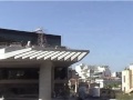SHALL THEY DEMOLISH A WORK OF ART, TO REVEAL A RESTAURANT TERRACE?17 DIONYSIOU AREOPAGITOU STR.This building was designed in 1930 by architect Vassilis Kouremenos (1875 -- 1957). He was from Epirus, an honours graduate of the Ecole des Beaux Arts in Paris,member of the Athens Academy from its inception, Professor at the NationalPolytechnic, painter, friend of Eleftherios Venizelos and PabloPicasso. He worked in Athens,Paris, Istanbul and Dublin and received prestigious awards.The façade is decorated with mosaics, sculptures and grey and pink marble. The mosaics depict Oedipus and the Sphinx(right) and the return of Theseus (left). The women by the door wear traditional dress from Dropoli in Epirus. Accordingto architecture historians, the building is a significant early 20th century monument and the most beautiful Art Deco specimen in Athens . It marks the shift from classicism tomodernism in an ideal synthesis.It was listed as Protected by the Ministry of Physical Planning in 1978, along with another eight on the same street, and as a Work of Art by the Culture Ministry in 1988. It stands in front of the site were the New Acropolis Museum was recently built. The official guidelines for the designs of the New Acropolis Museum explicitly stated that the buildings at numbers 17 and 19 would remain in place. The New Museum was allowed a height of several more meters than neighboring buildings, so that it could have a 
