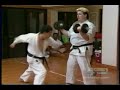 karate guy takes a great shot to the solar plexus,