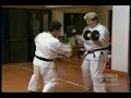 karate guy takes a great shot to the solar plexus,
