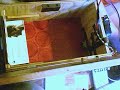 Aluminium thing fired into piece of cardboard.