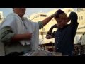 Jesse putting on tefilin for the...
