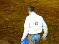 John Shoberg dismounting bronc after ride