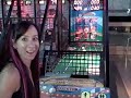 ashley playing a variety of games at the arcade: ping pong, baseball hitting, and baseball pitching