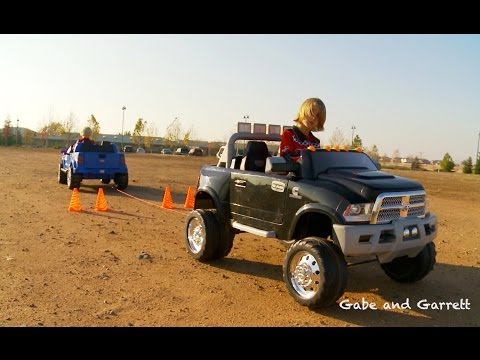 150 - The first in our series of Power Wheels Tug-of-War Battles! Watch the match up between the Power Wheels Ford F150 Raptor vs the Kid Trax Dodge Ram 3500 Duall...