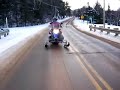 Ski wheels for snowmobiles with auto retract