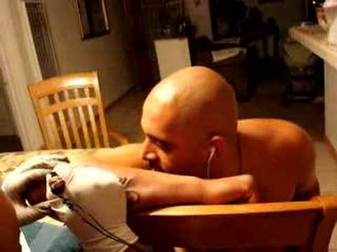 PUSSY GETTING A TATTOO. HES STILL A BITCH