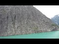DestinationsInFlorida.com or call 877-918-8941 for help planning your Alaskan cruise. Our video of the Tracy Arm Fjord during our Alaskan cruise simply does not do justice to this amazingly beautiful part of Alaska. Until recently, only kayaks were allowed into the Tracy Arm. Now, cruise ships somehow navigate the narrow fjord to the Sawyer Glacier. The weather was so good on the day we went that the ship got closer to the glacier than it had all season! It was amazing. Watch for icebergs, seals, waterfalls, mountain striations from the former glacier and especially note the color of the water. The change from black Pacific water to this teal green water was nearly instantaneous! The fjord is part of the 30 mile long Tracy Arm - Fords Terror Wilderness region, located about 60 miles southeast of Juneau. The fjord is truly one of the most dramatic locations in Alaska, or in all of the world, for that matter. The sheer, glacier-carved walls are often shrouded in mist. Glacial calving in Tracy Arm can often be quite spectacular, as huge chunks of ice break off and plunge into the frigid waters below. Unfortunately, we didn't get to see any calving on our cruise aboard the Celebrity Infinity. Literally hundreds of waterfalls cascade down the sides of the fjord, creating an almost otherworldly atmosphere. It's something you really have to see to believe, it's just that unique and positively breathtaking to behold. Famed naturalist John Muir compared the glacial-carved sheer <b>...</b>