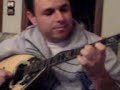 a friend learning playing a greek instrument