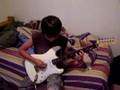 Orion Playing The Guitar