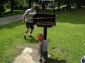 Papa chasing Noah with squirt gun