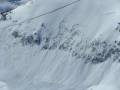 Video: Snowmobiler causes avalanche