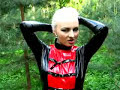 Fetish Woman In PVC Catsuit In The Forest