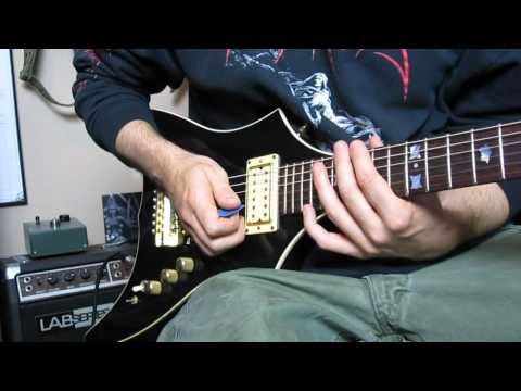 how to properly hold a guitar pick
