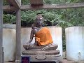 monkeys on a Buddha statue in Phetchaburi (Thailand)