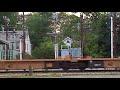 csx trains and a guy walking around lowered gates