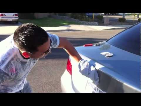 how to remove bmw trunk emblem