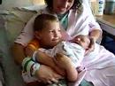Austin holding his new Brother Nathan