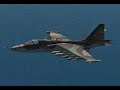 1.Welcome to this Su-25 training lesson on the employment of guns and unguided rockets against ground targets. 2.You can take over control at anytime by pressing the ESC key. 3.To pause the lesson, press the PAUSE key. 4.The Su-25 is armed with the GSh-302 twin-barrel 30 mm internal cannon. In addition, up to four SPPU-22 gun pods can be carried externally. Each gun pod is equipped with an GSh-23 twin-barrel 23 mm cannon that can traverse down to point at the ground. The Su-25 is also armed with a number of different unguided rocket types: The S-5 57 mm rocket has 32 rockets per pod; The S-8 80 mm rocket has 20 rockets per pod; The S-13 130 mm rocket has 5 rockets per pod; The S-24 heavy rocket is loaded one per pylon; And the S-25 is an improved heavy rocket that is carried inside a dedicated launch tube. Only one S-25 can be carried per station. 5.In total, up to 8 stations can be loaded with rockets of various types. 6.To begin, we'll select air-to-ground mode by pressing the 7 key. The Weapons Control System (WCS) will automatically select S-8 rockets that are loaded on the outer stations. 7.Perform the attack from a dive. 8.The targeting reticle indicates the calculated impact point. To maximize accuracy, press RSHIFT + O to activate the laser to measure the slant range to target. The green lamp will light to indicate that the laser is active. A range scale around the targeting reticle shows the range to impact point. 9.The orange lamp indicates that Launch is <b>...</b>