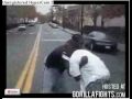 Two Thugs Fight In Street Two thugs have a fight in a street.