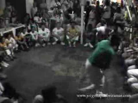 Camaleão - Amazing game between two generations of the Capoeiragem in the releasing of Mestre Russo's first book at Copa Leme, hosted by Mestre Marrom. www.jorgeitapuab...