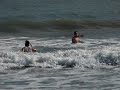 Scherry & Grant talkin smack while surfing