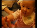 Baby Natalie shake hands and high 5 in pink overalls