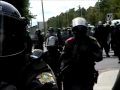 please read!!!  this video shows how the police continued to build up the intimidation level throughout the day. the crowd was doing fine, then the first group of riot police came marching out and formed a line. they had no masks and a white patch on their shoulder. the crowd took notice and approached the line. things were fine for a few hours, but then another group of police switched places with the first ones. this second group had a red patch instead of a white one (a little more intimidating). as a result of that, the crowd got a little more worked up. after a few more hours, those cops were switched for ones wearing gas masks. again as a result the crowd was getting a little bit more worked up. then the next 
