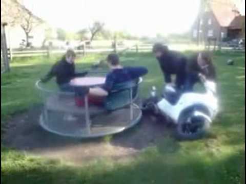 Guy falls off from a very fast carousel