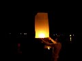 Thai Paper Lanterns Flying Off Kata Beach Over Sandpiper