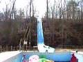Video: Kid slides down water slide into empty pool