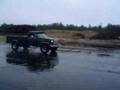 ford truck driving by