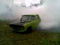 Mutant Green Ute Doing a Static Burnout