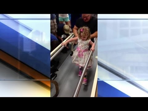 Nugent - Surrounded by friends, family, and plenty of cameras, 2-year-old Ireland Nugent took her first steps with prosthetic legs Monday. The little girl lost both o...